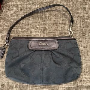Large Coach wristlet in gray. The C’s are a glittery silver color.